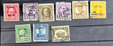 A collection of vintage postage stamps from the Panama Canal Zone, featuring various colors and designs, some with over-printed text.