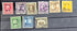 A collection of vintage postage stamps from the Panama Canal Zone, featuring various colors and designs, some with over-printed text.