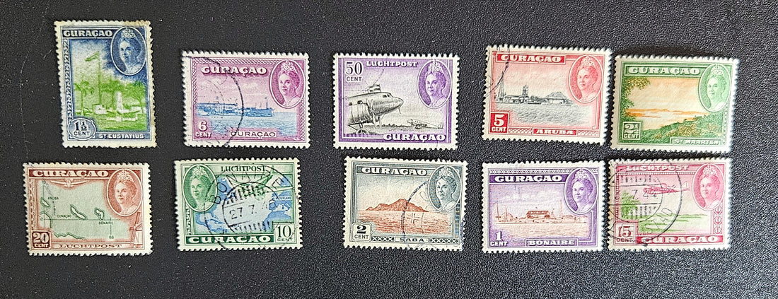 A collection of vintage postage stamps from the Netherlands colonies, featuring various designs and denominations.