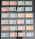 An assortment of vintage postage stamps featuring King George VI, with various colors and designs, displayed in a row.