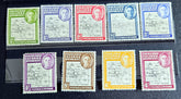 A set of vintage Falkland Islands stamps from various reigns, displayed in a row.