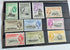 A set of vintage Falkland Islands stamps from various reigns, displayed in a row.