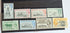 A set of vintage Falkland Islands stamps from various reigns, displayed in a row.
