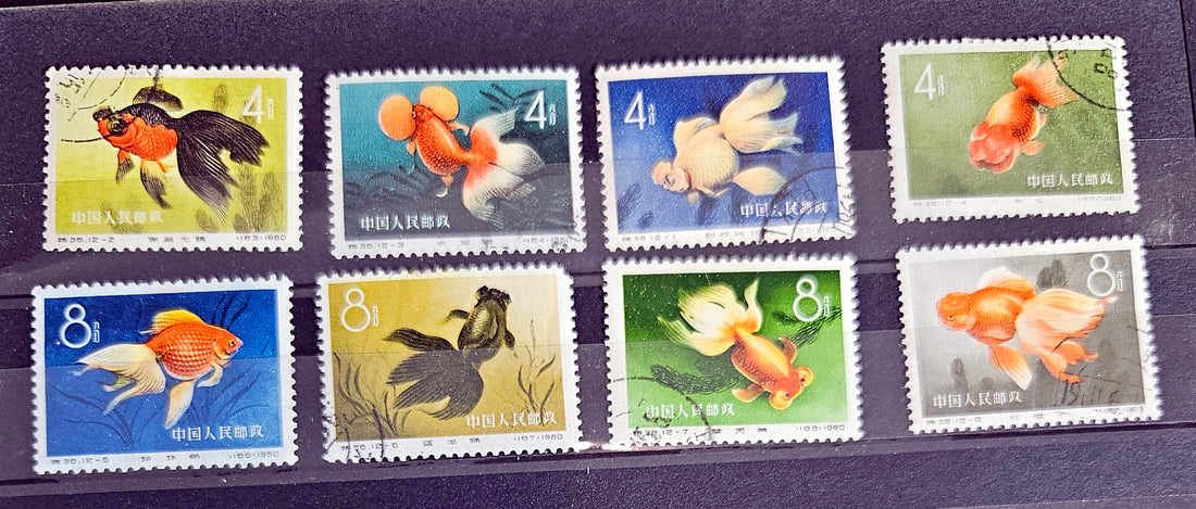 A collection of Chinese Goldfish stamps showcasing various goldfish illustrations with denominations.