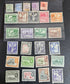 A collection of vintage British Guyana stamps from the reign of King George V, featuring various designs including portraits and imagery of local flora and fauna.