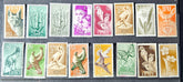 Collection of vintage stamps with various designs and colors.