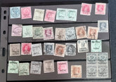 A collection of various Indian postage stamps displayed in a row, showcasing different colors and designs.