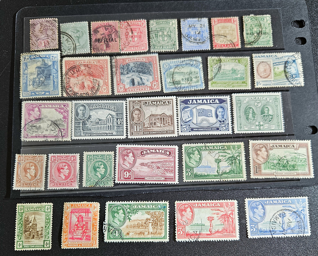 A collection of vintage Jamaica stamps from various reigns of British monarchs, displayed on a black background.