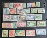 A collection of vintage Jamaica stamps from various reigns of British monarchs, displayed on a black background.