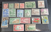 A collection of vintage Jamaica stamps from various reigns of British monarchs, displayed on a black background.
