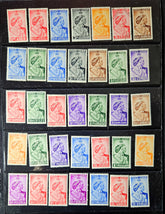 Collection of vintage stamps in a display case with various colors and designs.