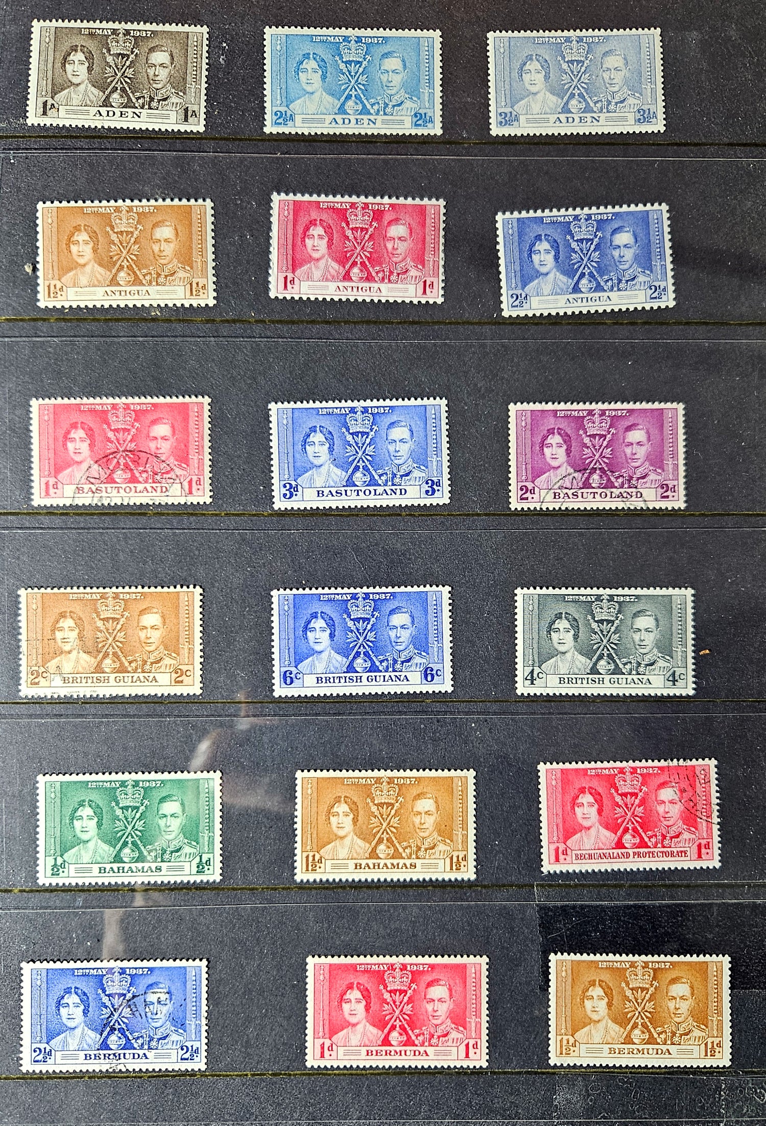 Collection of vintage stamps with portrait designs on a black background