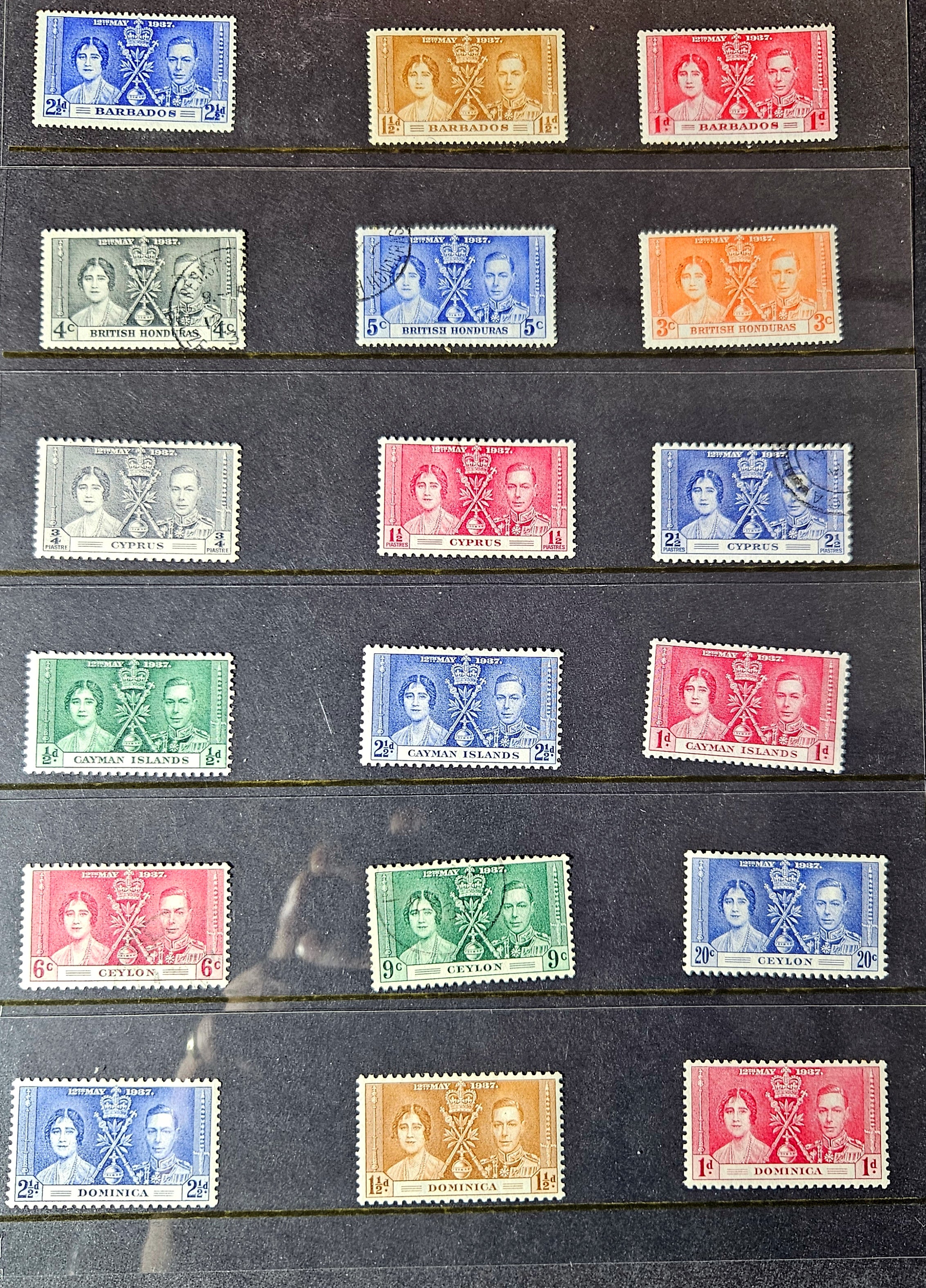 Collection of vintage stamps with portrait designs on a black background