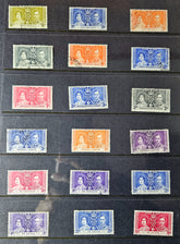 Collection of vintage stamps with portrait designs on a dark background