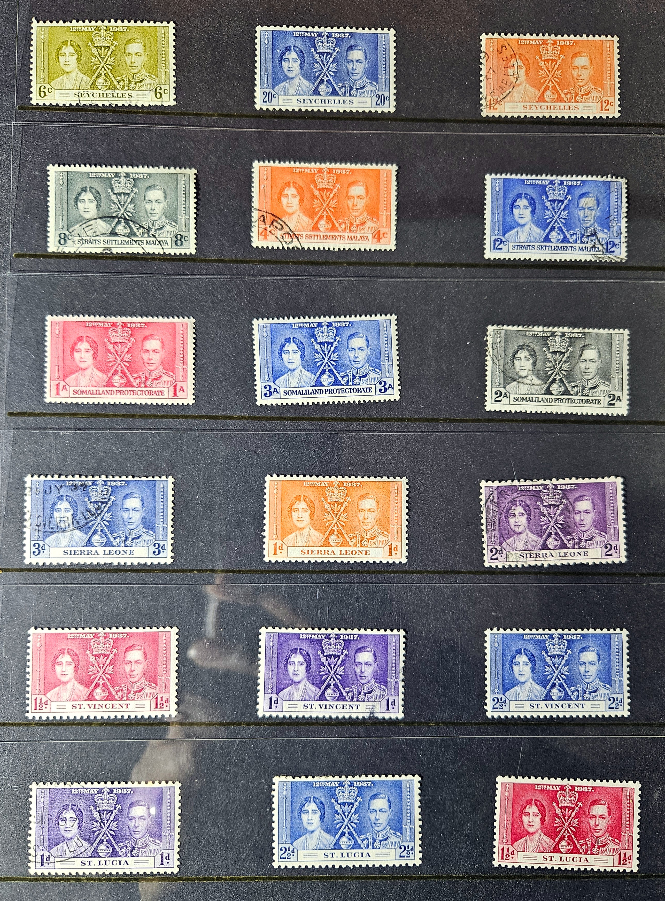 Collection of vintage stamps with portrait designs on a dark background