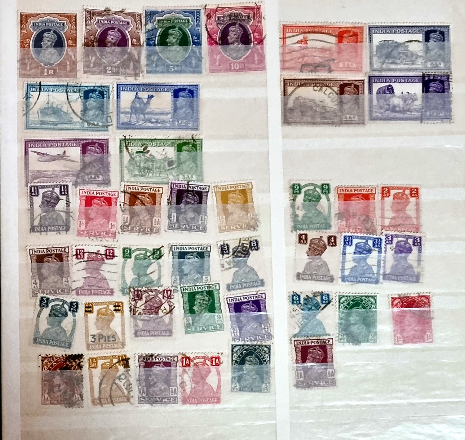 A selection of vintage India stamps from various regions and periods, displayed in a row.