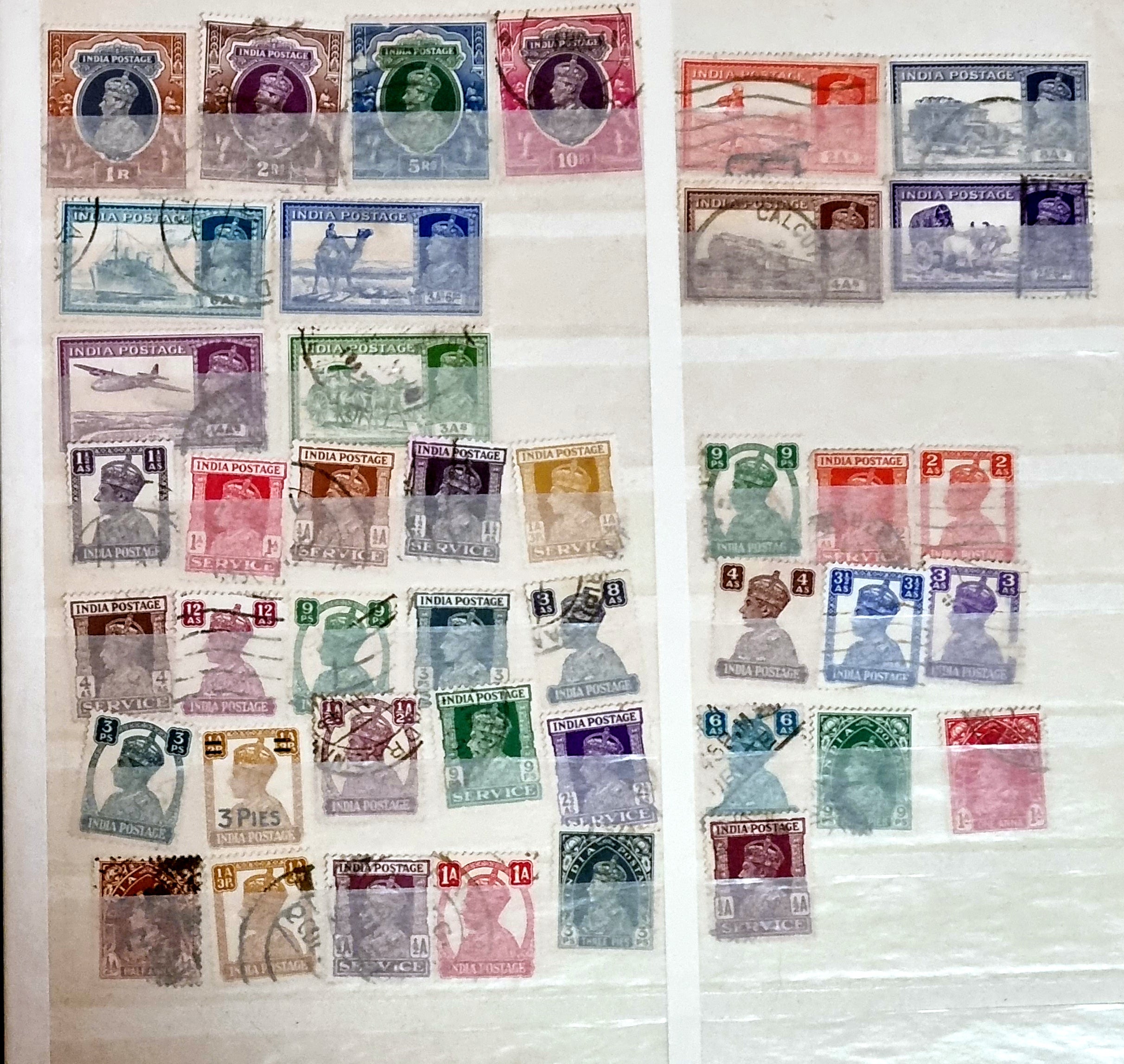 A selection of vintage India stamps from various regions and periods, displayed in a row.