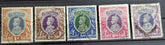 A selection of vintage India stamps from various regions and periods, displayed in a row.