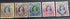 A selection of vintage India stamps from various regions and periods, displayed in a row.