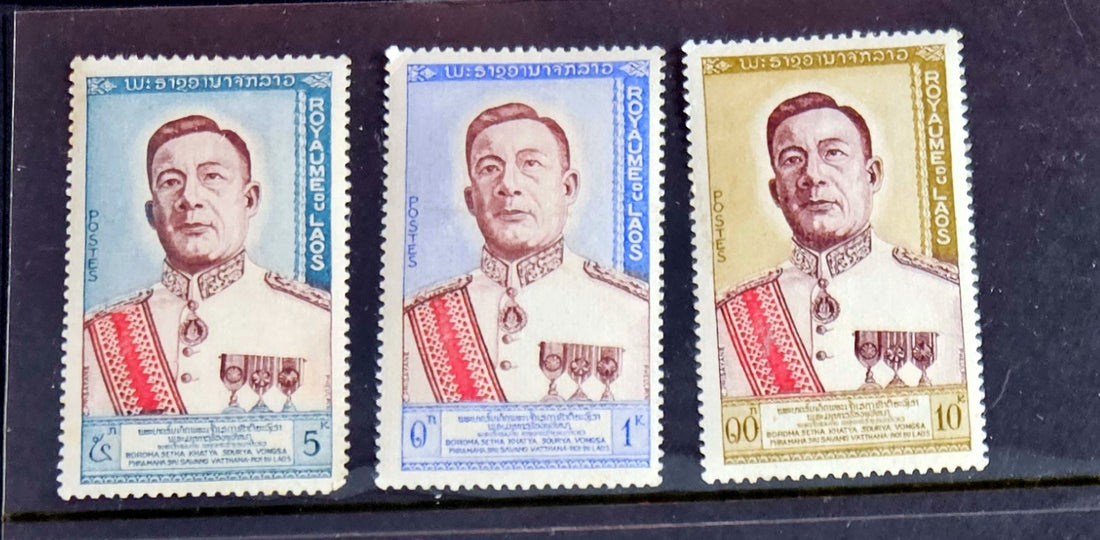 A set of vintage postage stamps from Laos featuring images of historical figures, traditional art, and natural beauty.
