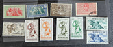 A set of vintage stamps from French Madagascar, featuring various designs including floral patterns and portraits.