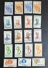 A set of vintage stamps from French Madagascar, featuring various designs including floral patterns and portraits.