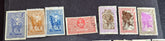 A set of vintage stamps from French Madagascar, featuring various designs including floral patterns and portraits.