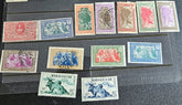 A set of vintage stamps from French Madagascar, featuring various designs including floral patterns and portraits.