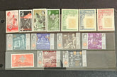 A collection of vintage postage stamps from Malta featuring various designs and colors, arranged in no specific order on a surface.