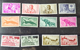 Collection of vintage stamps with various designs on a dark background