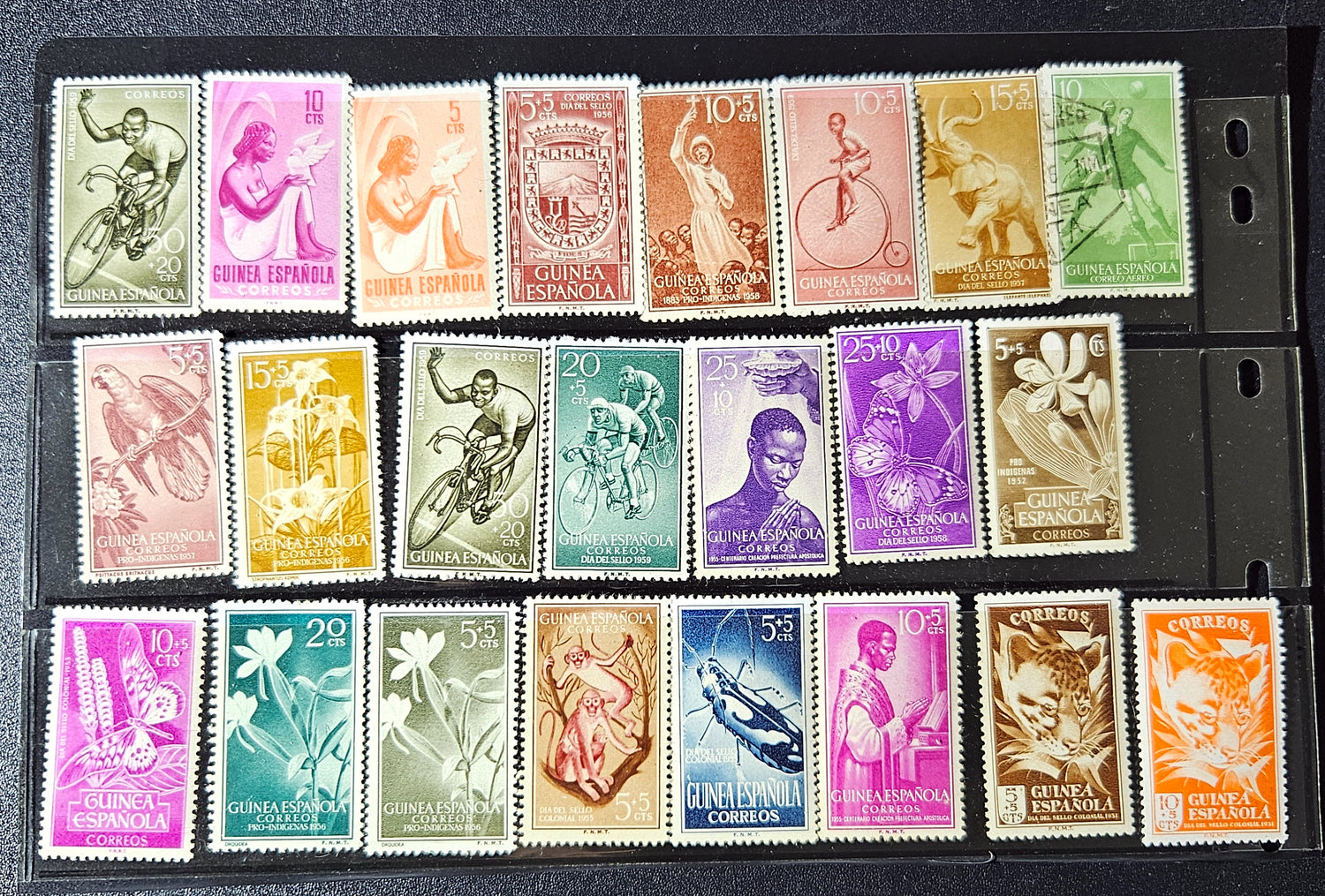 Collection of vintage stamps with various designs and colors arranged in a grid.