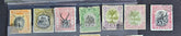 A set of vintage postage stamps from North Borneo and Sabah with various designs and denominations.