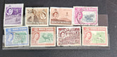 A set of vintage postage stamps from North Borneo and Sabah with various designs and denominations.