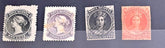 Four vintage Nova Scotia stamps with different designs and colors on a dark background