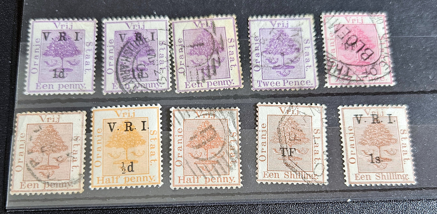 A collection of vintage postage stamps from the Orange Free State, featuring various denominations and cancellation marks, housed in a plastic sleeve.
