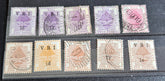 A collection of vintage postage stamps from the Orange Free State, featuring various denominations and cancellation marks, housed in a plastic sleeve.