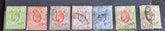 A collection of vintage postage stamps from the Orange Free State, featuring various denominations and cancellation marks, housed in a plastic sleeve.