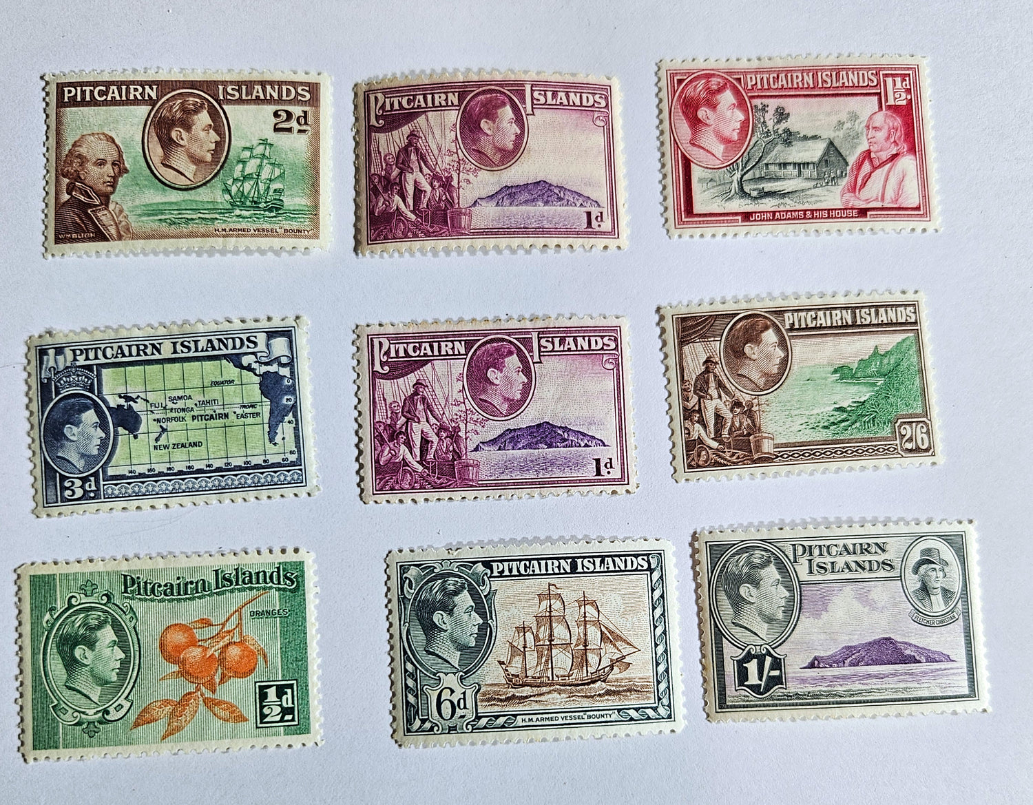 A collection of vintage Pitcairn Islands stamps from the British Commonwealth, featuring various designs including portraits and iconic imagery.