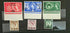 Collection of vintage stamps featuring Queen Elizabeth II on a dark background