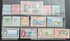 A collection of vintage Bahama postage stamps displayed on a clear plastic protector sheet against a dark textured background. The stamps feature various colors and designs, including portraits, landscapes, and historical themes.
