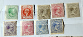 Collection of vintage postage stamps with different designs and colors on a white background.