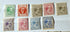 Collection of vintage postage stamps with different designs and colors on a white background.