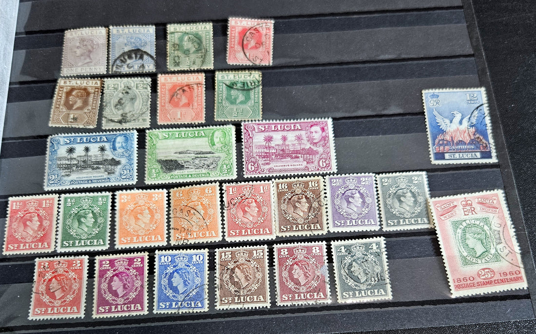 A collection of St. Lucia vintage stamps from various eras, displayed on a flat surface.