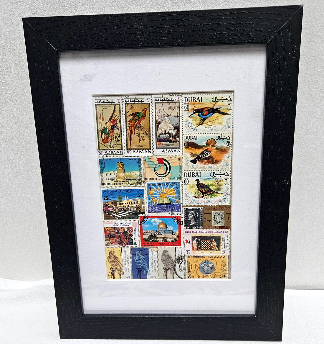 Framed collage of postage stamps with &