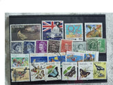 A collection of various Australian postage stamps from different eras