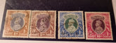 A selection of vintage India stamps from various regions and periods, displayed in a row.
