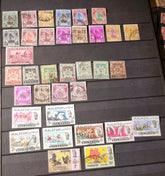 A collection of various vintage Malay state stamps 