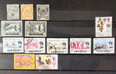 A collection of various vintage Malay state stamps