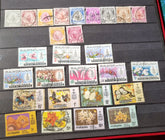 A collection of various vintage Malay state stamps