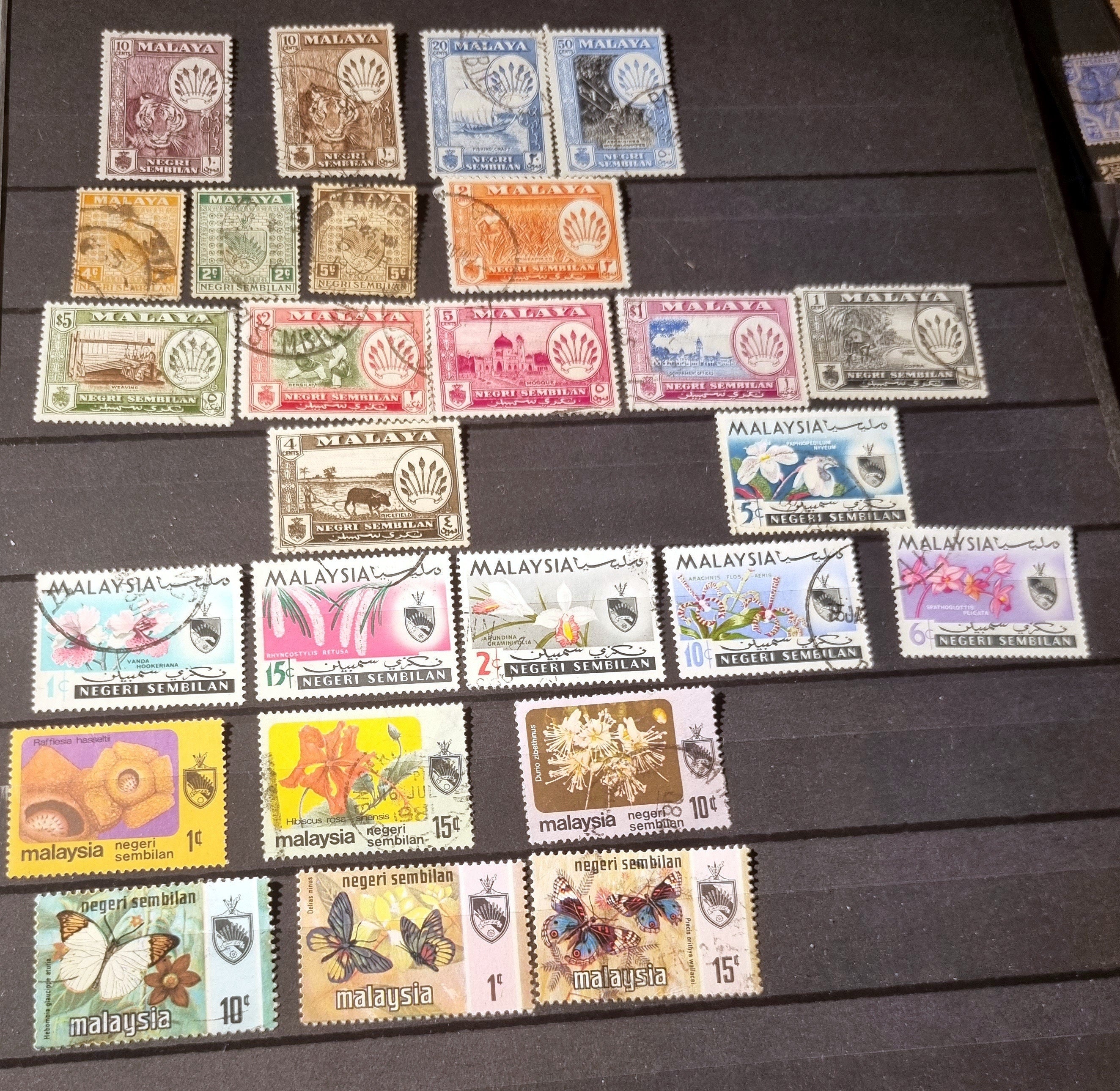 A collection of various vintage Malay state stamps 